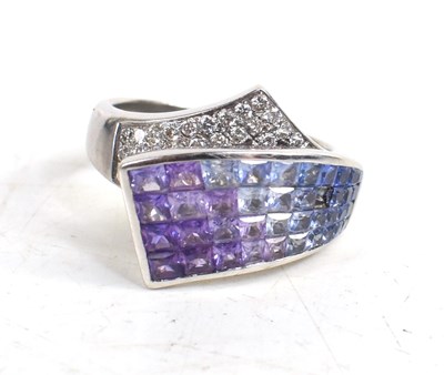 Lot 245 - An 18ct white gold, sapphire and diamond cross...