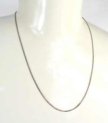 Lot 101 - A 9ct white gold fine chain link necklace,...