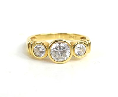 Lot 223 - A 14ct gold and cubic zircon three stone ring,...