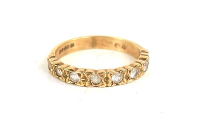 Lot 119 - A 9ct gold and paste half eternity ring, 2.2g.