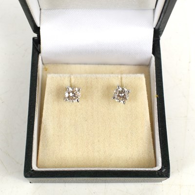 Lot 6 - An 18ct white gold and diamond stud earrings,...