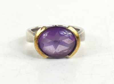 Lot 8 - A silver, silver-gilt and amethyst cabochon...