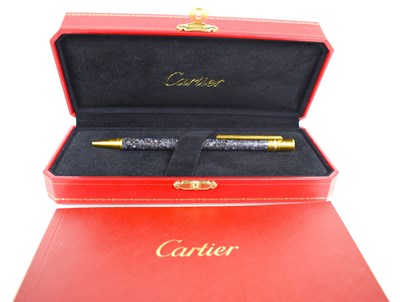 Lot 1 - A Cartier 'Trinity Resille' ballpoint pen, in...