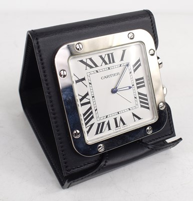 Lot 2 - A Cartier travel alarm clock in stainless...