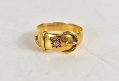 Lot 222 - An 18ct gold and diamond buckle form ring, set...