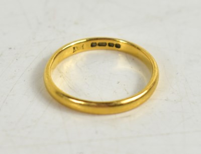 Lot 155 - A 22ct gold wedding band, size M, 2.6g.