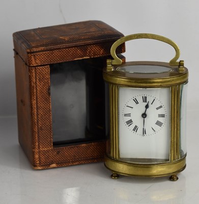 Lot 331 - A 19th century French carriage clock, of oval...
