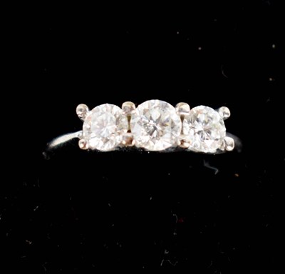 Lot 96 - A 18ct white gold and diamond three stone ring,...
