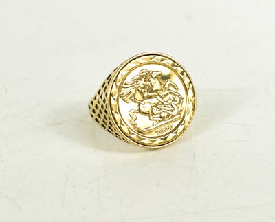 Lot 36 - A 9ct gold sovereign style ring, with lattice...