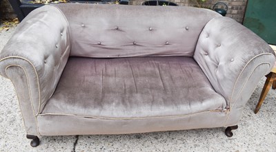 Lot 513 - An Edwardian settee with drop down side.