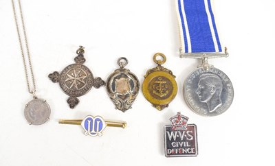 Lot 192 - A selection of medals and badges, to include a...