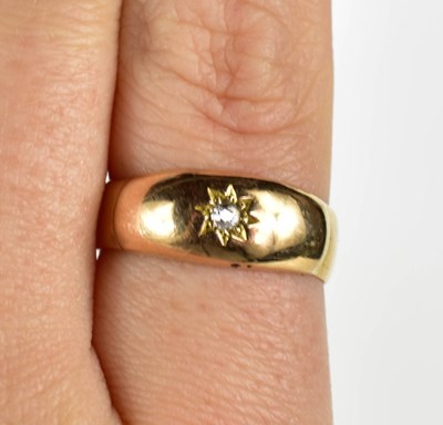 Lot 51 - A 9ct gold and diamond ring, the single...