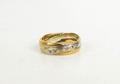 Lot 59 - A 9ct white and yellow gold cross over ring...
