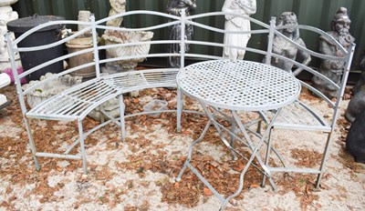 Lot 465 - A curved metal ware bench, with matching table.