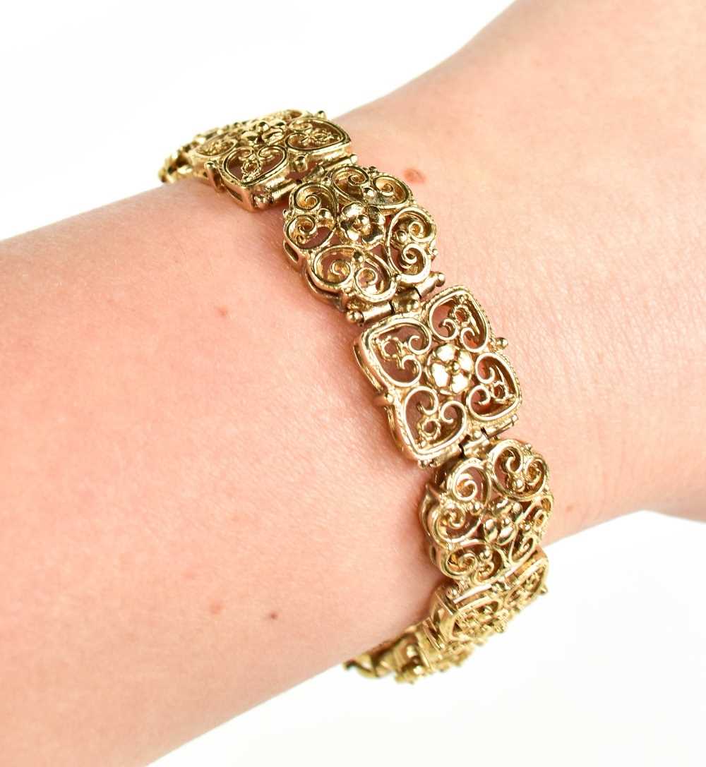 Lot 4 - A 9ct gold bracelet, composed of pierced and...