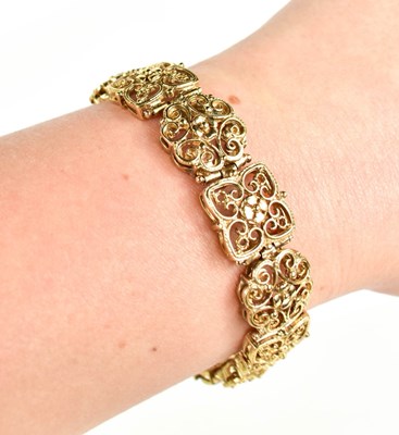 Lot 4 - A 9ct gold bracelet, composed of pierced and...