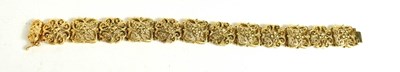 Lot 4 - A 9ct gold bracelet, composed of pierced and...