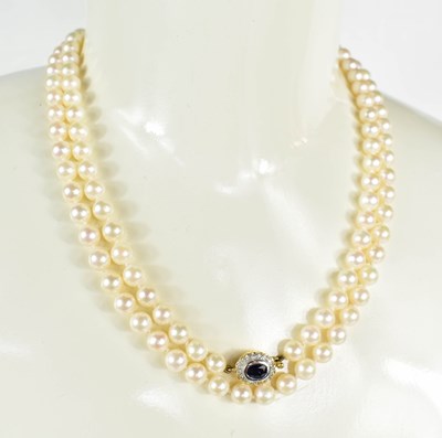 Lot 132 - A 14k gold and pearl necklace, the oval slide...