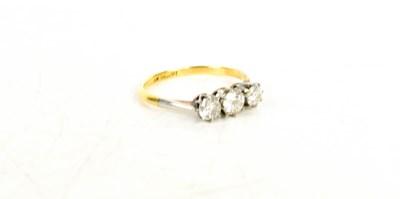 Lot 41 - An 18ct gold and diamond three stone ring, the...
