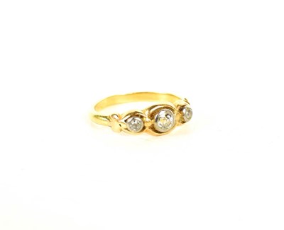 Lot 26 - A gold and diamond three stone ring, the...