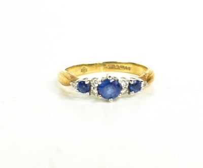 Lot 28 - A 9ct gold, diamond and sapphire ring, size J,...