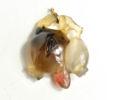 Lot 124 - A Chinese jade pendant, carved in the form of...