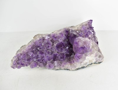 Lot 210 - A section of natural amethyst, 32cm long.