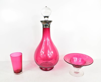 Lot 236 - A cranberry glass and silver plated decanter...