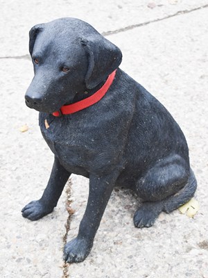 Lot 466 - A resin garden statue of a black labrador,...