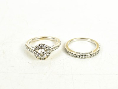 Lot 98 - An 18ct white gold and Tolkowsky diamond ring,...