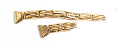 Lot 137 - Two sections of a 9ct gold watch strap, 13g.