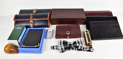 Lot 245 - A selection of wallets: two Cartier, an Andrew...