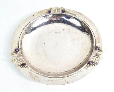Lot 228 - A sterling silver bowl, set with six purple...