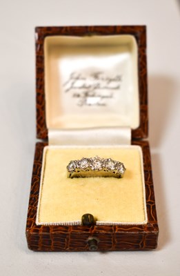 Lot 108 - An 18ct gold and diamond five stone ring, the...