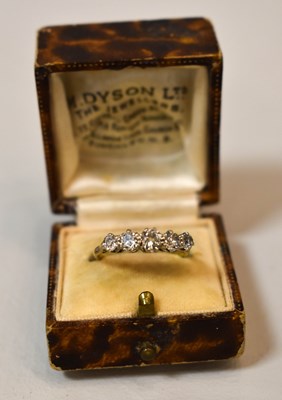 Lot 84 - An 18ct gold and diamond five stone ring, the...