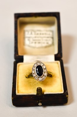Lot 85 - An 18ct gold, sapphire and diamond ring, the...