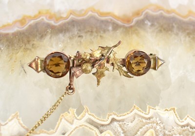 Lot 60 - A 9ct gold and citrine bar brooch, designed...