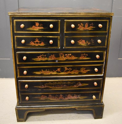Lot 579 - A black lacquered Chinoiserie chest of drawers,...