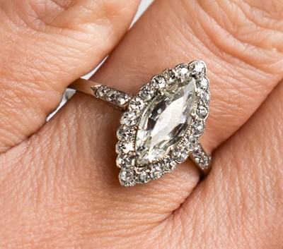 Lot 33 - A platinum and diamond ring, the central...