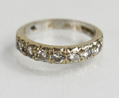 Lot 3 - An 18ct white gold and diamond set half hoop...