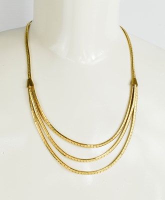 Lot 10 - A 14ct gold necklace, the single strand...