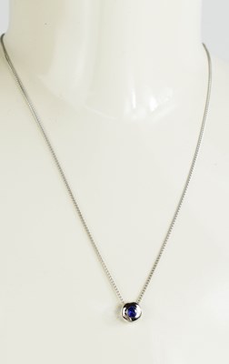 Lot 30A - A 9ct white gold and sapphire pendant and...