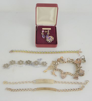 Lot 28a - A silver charm bracelet together with two...
