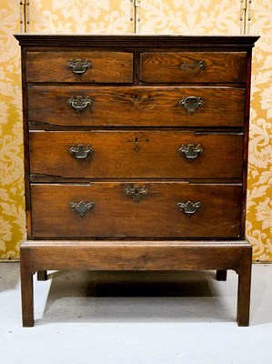 Lot 594 - An 18th century oak chest on stand, comprising...