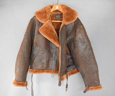 Lot 322 - A Mil-Tec brown leather bomber jacket, label...