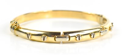 Lot 32 - A 9ct gold Italian bangle, in the Cartier...