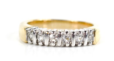 Lot 38 - A yellow metal and paste ring, the six stones...