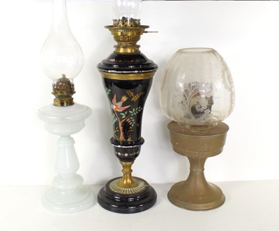 Lot 235 - A group of three oil lamps to include hand...