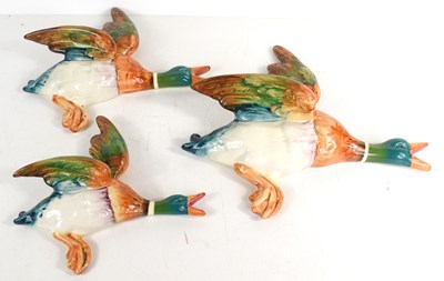Lot 211 - A group of three Beswick graduated wall ducks,...