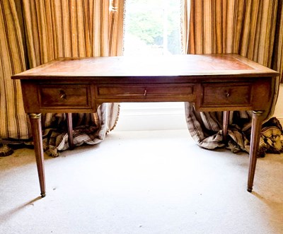 Lot 395 - A 19th century French mahogany desk, with tan...